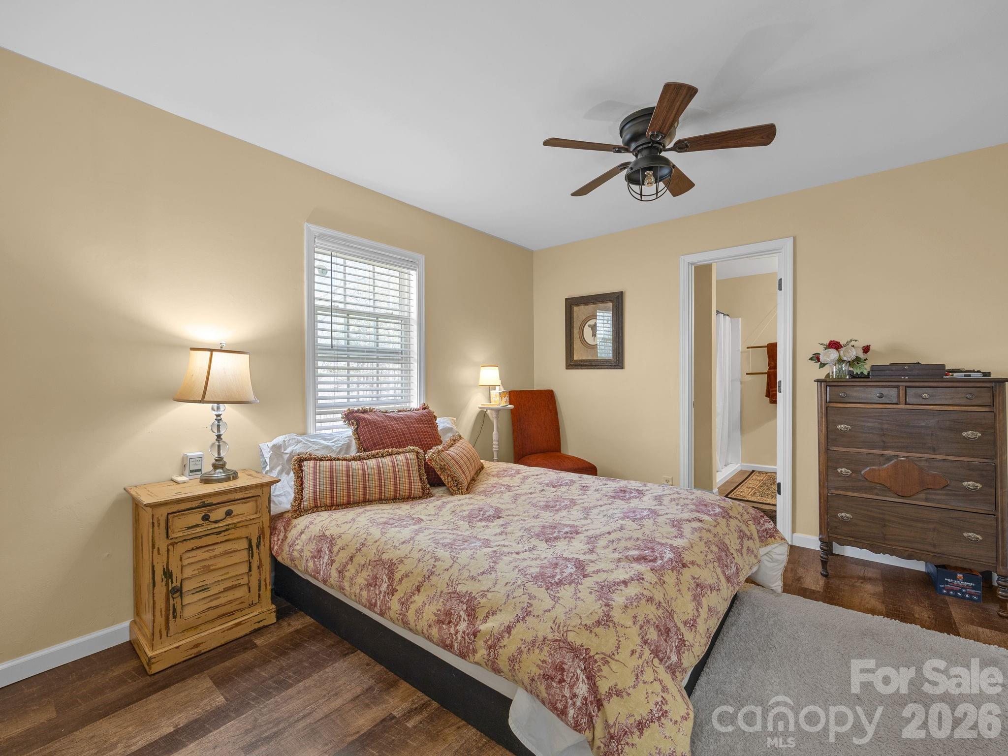1434 Lake Adger Road Mill Spring, NC 28756 - Photo 18 of 47 a bedroom with a bed and a dresser