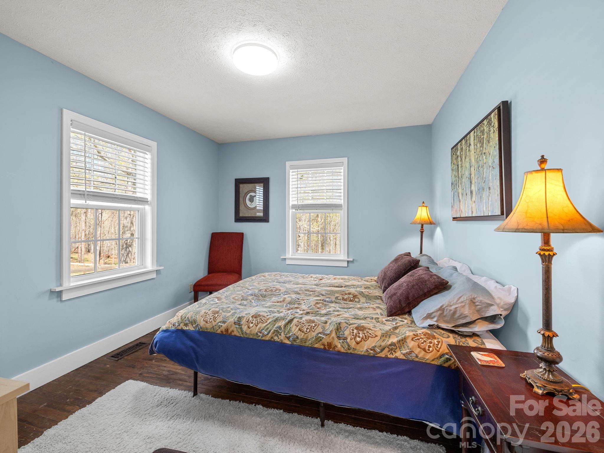 1434 Lake Adger Road Mill Spring, NC 28756 - Photo 24 of 47 a bedroom with a bed and a window