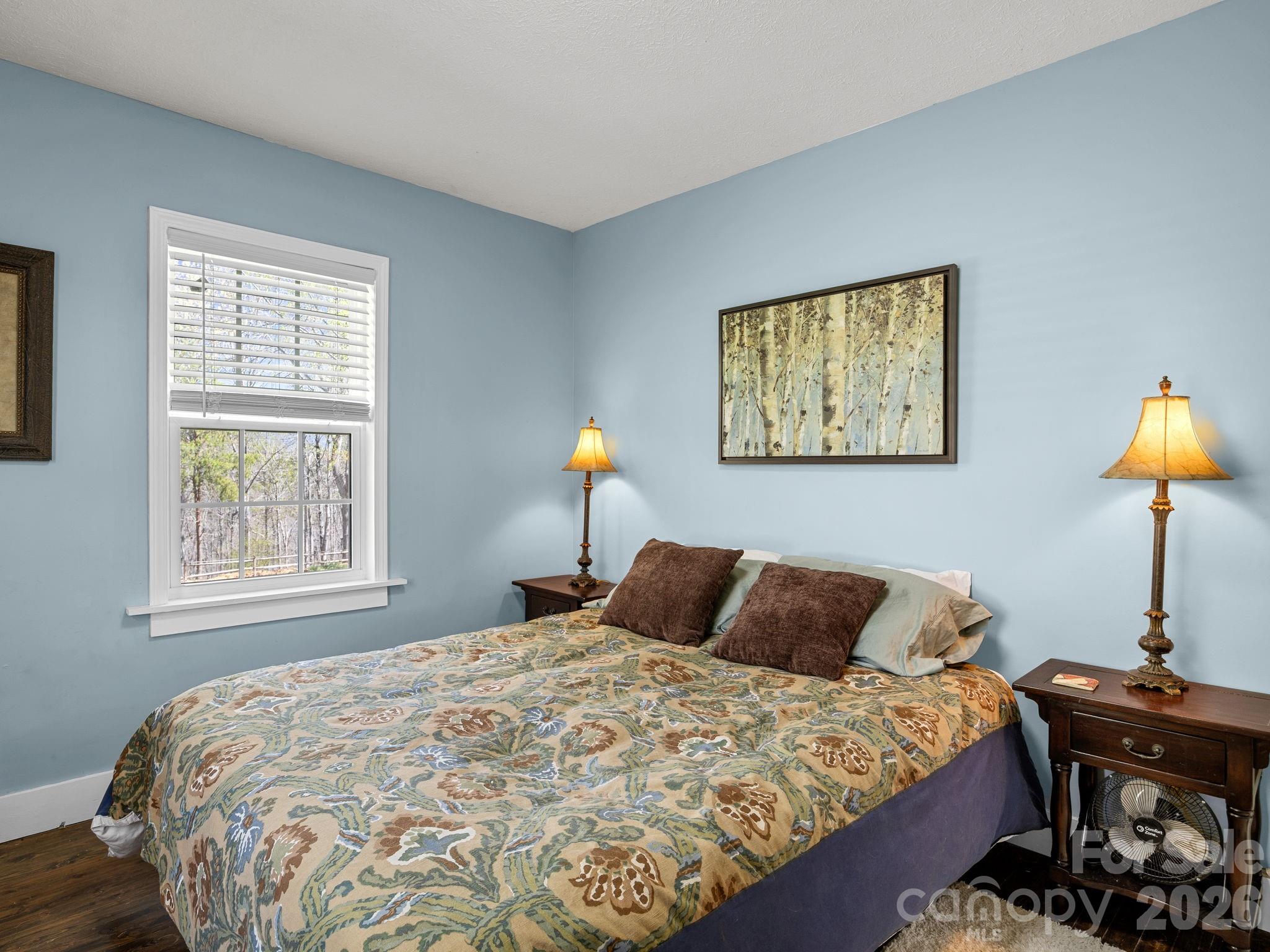 1434 Lake Adger Road Mill Spring, NC 28756 - Photo 26 of 47 a bedroom with a bed and a window