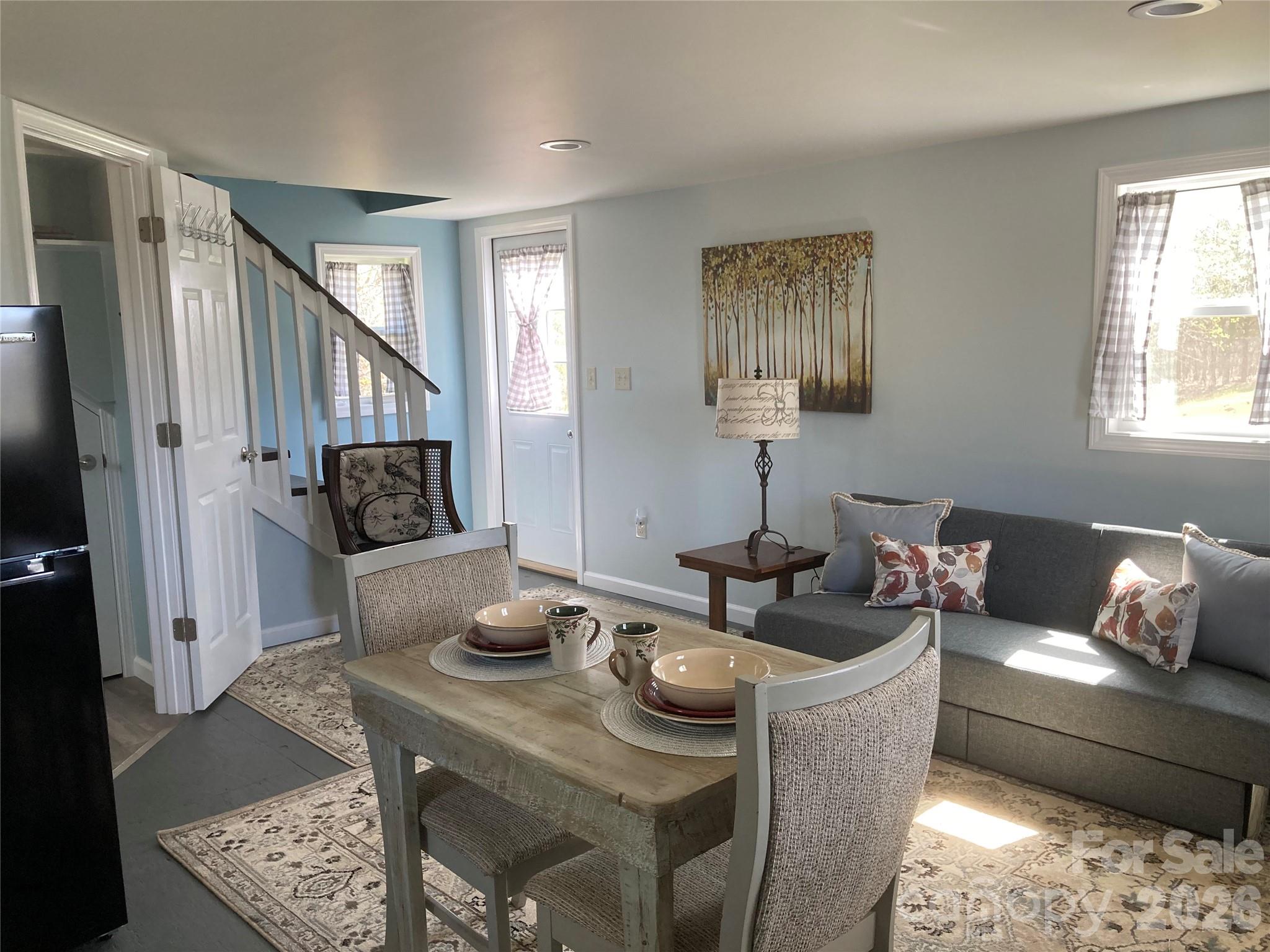 1434 Lake Adger Road Mill Spring, NC 28756 - Photo 31 of 47 a living room with furniture and a window