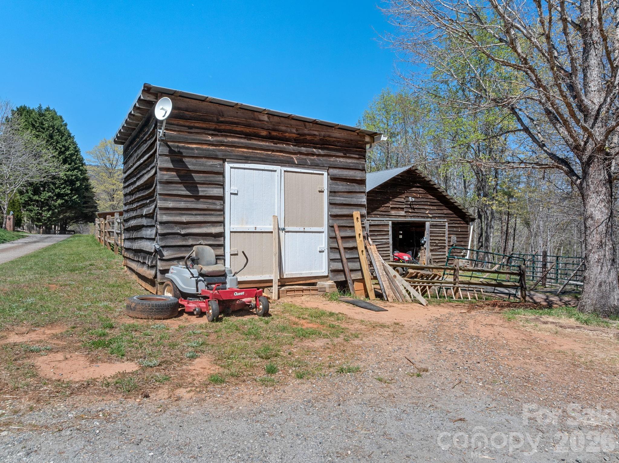 1434 Lake Adger Road Mill Spring, NC 28756 - Photo 36 of 47 a view of house with outdoor space