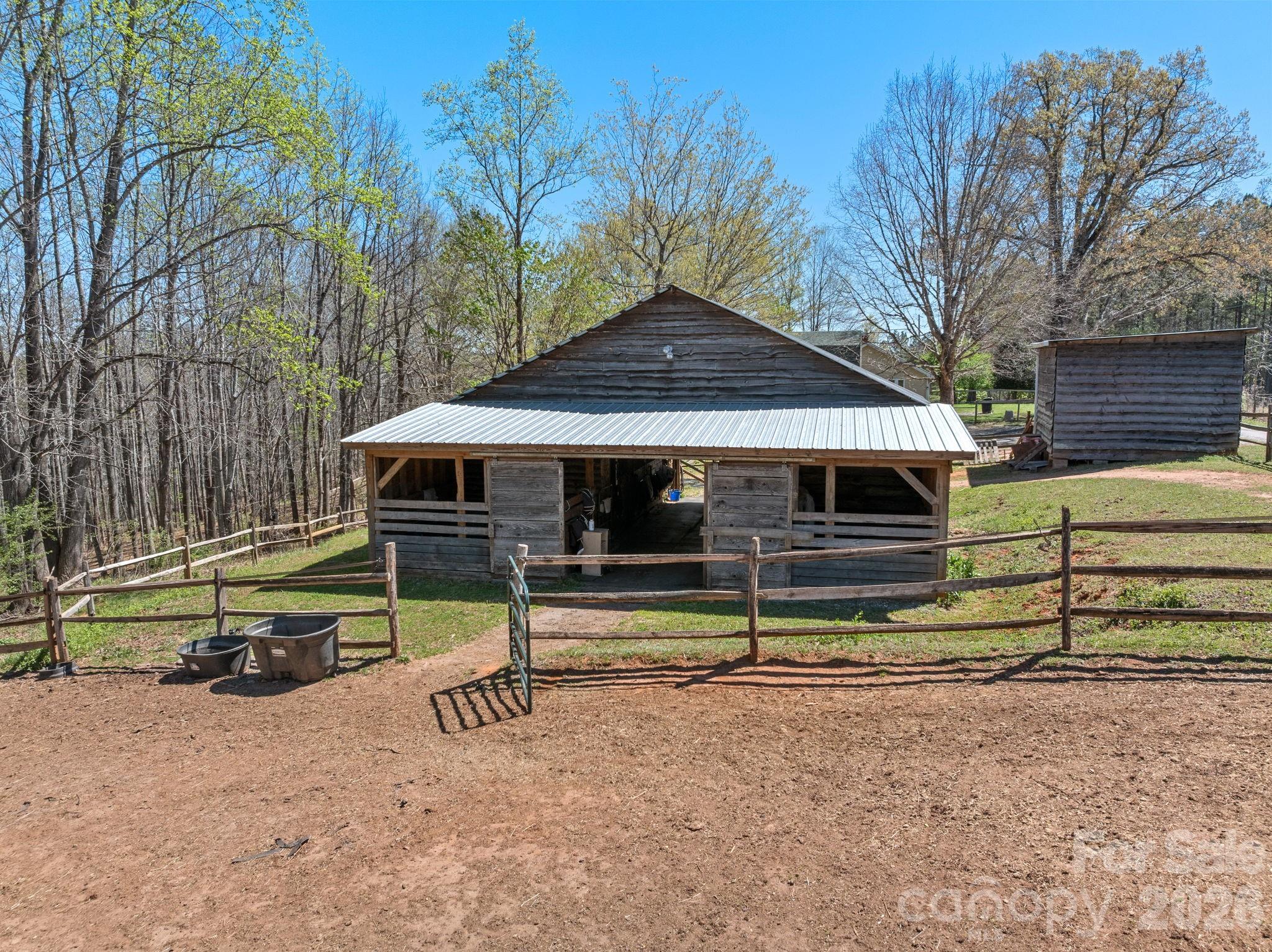 1434 Lake Adger Road Mill Spring, NC 28756 - Photo 37 of 47 a view of backyard with wooden fence and a slide