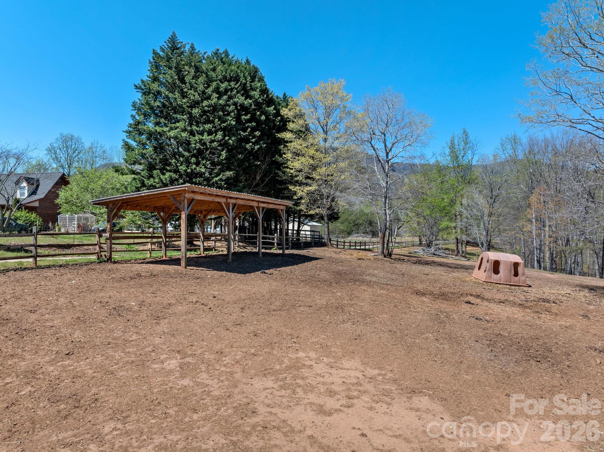 1434 Lake Adger Road Mill Spring, NC 28756 - Photo 38 of 47 a view of house with outdoor space and sitting area