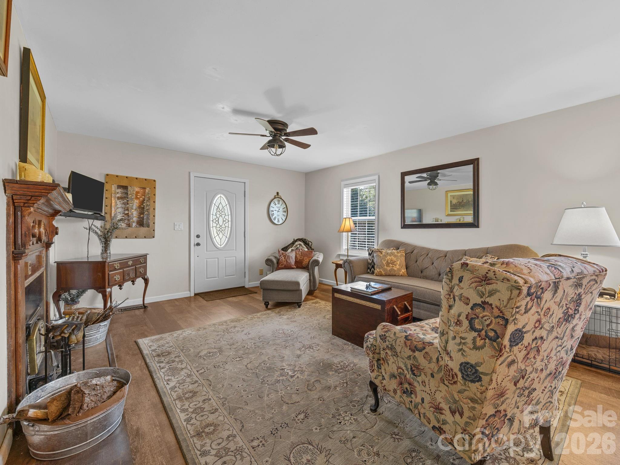 1434 Lake Adger Road Mill Spring, NC 28756 - Photo 6 of 47 a living room with furniture and a flat screen tv