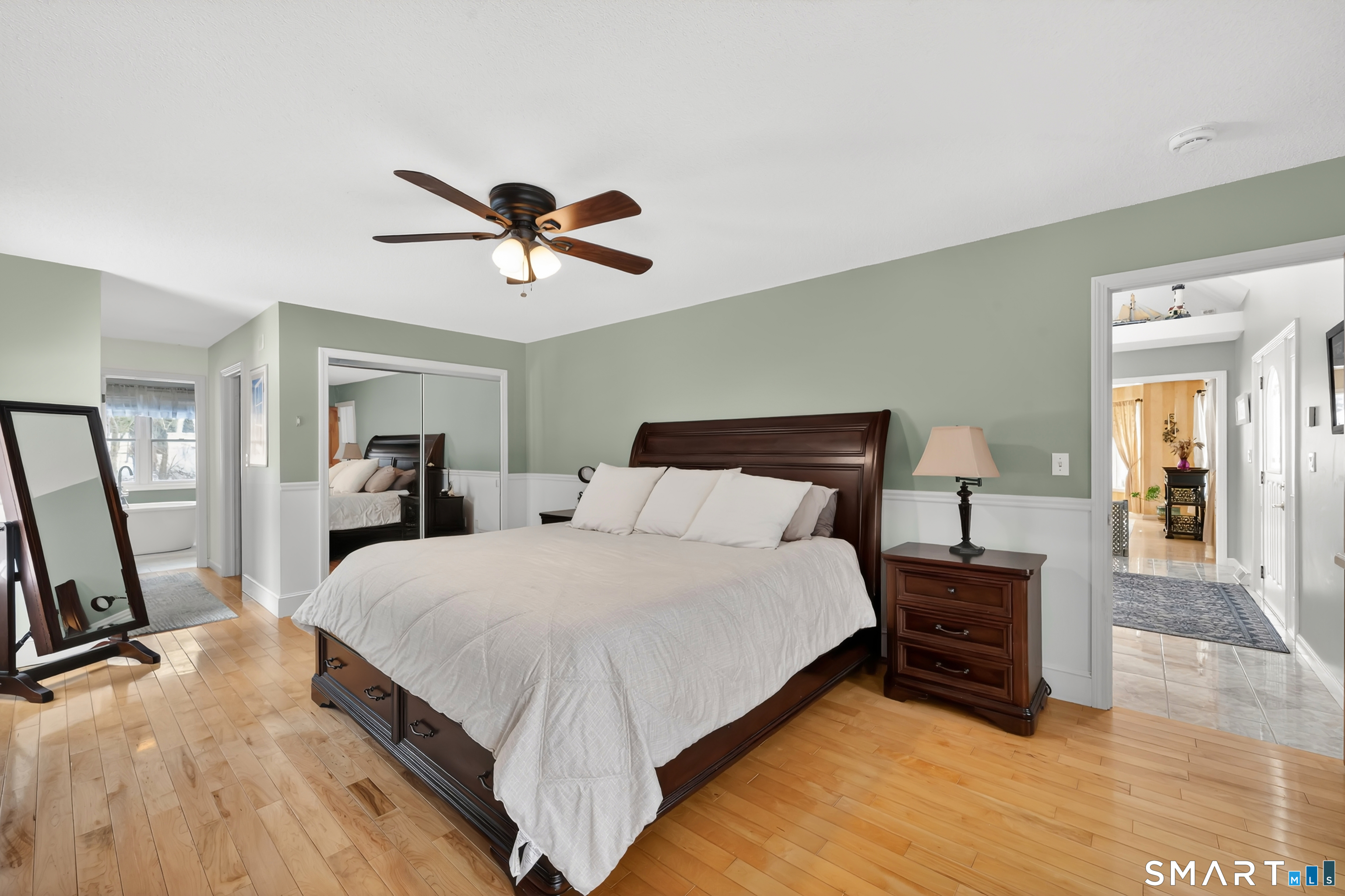 16 Higgins Way Tolland, CT 06084 - Photo 11 of 42 a bedroom with a bed and a chandelier