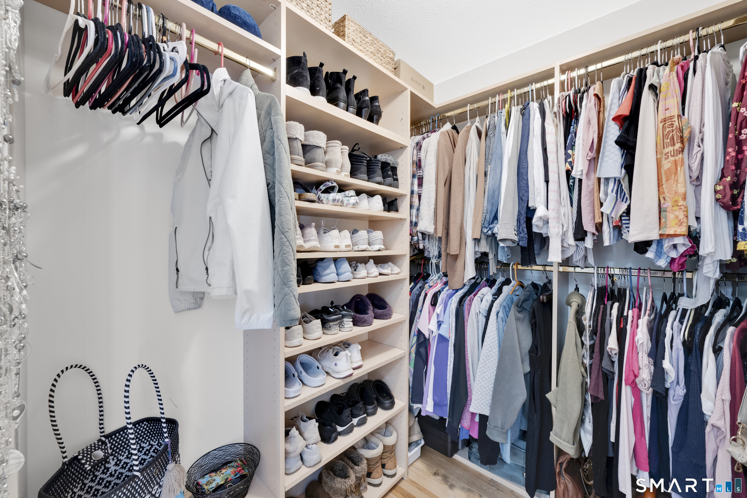 16 Higgins Way Tolland, CT 06084 - Photo 12 of 42 a view of walk in closet with clothes and shoes