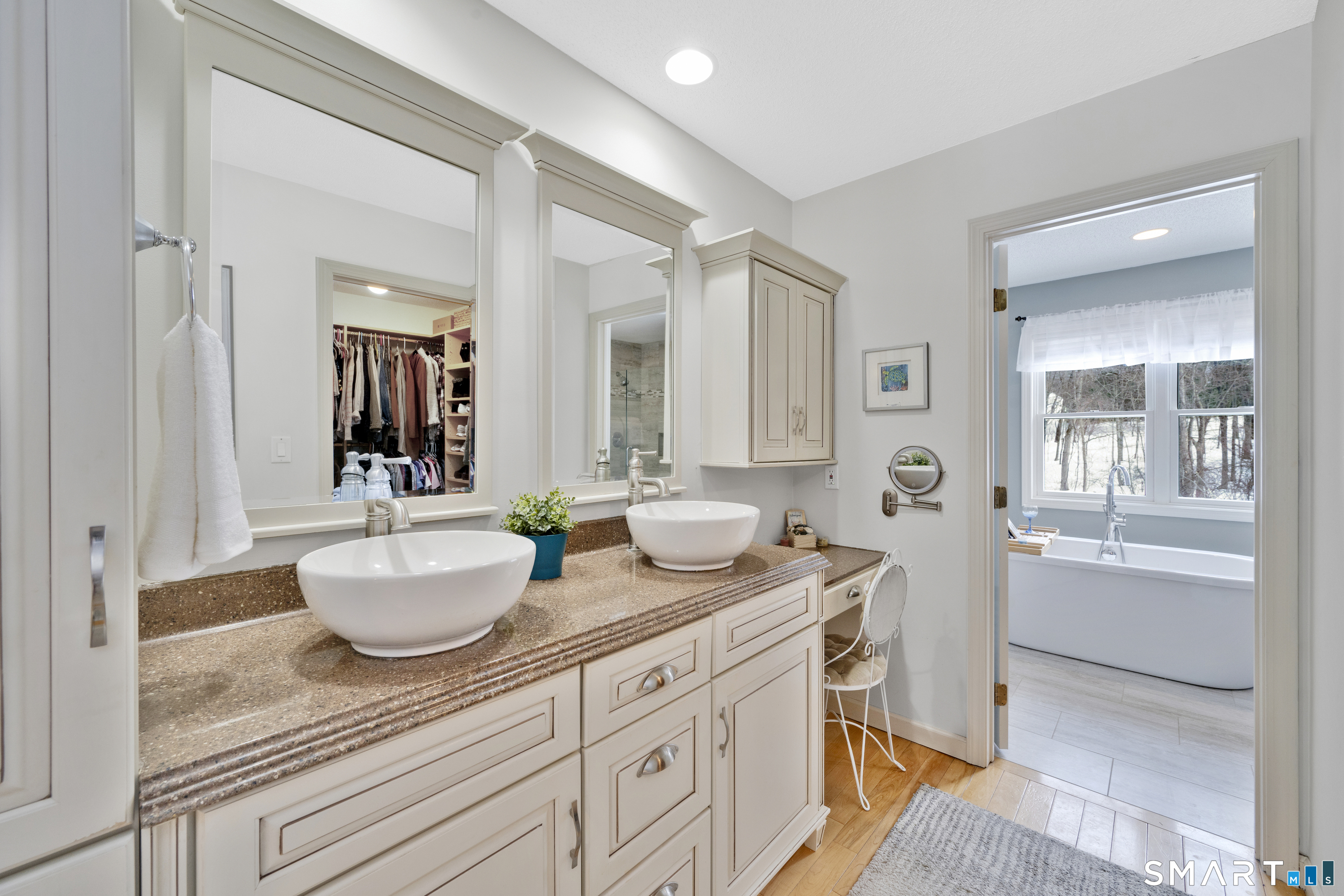 16 Higgins Way Tolland, CT 06084 - Photo 14 of 42 a spacious bathroom with a granite countertop sink and a mirror