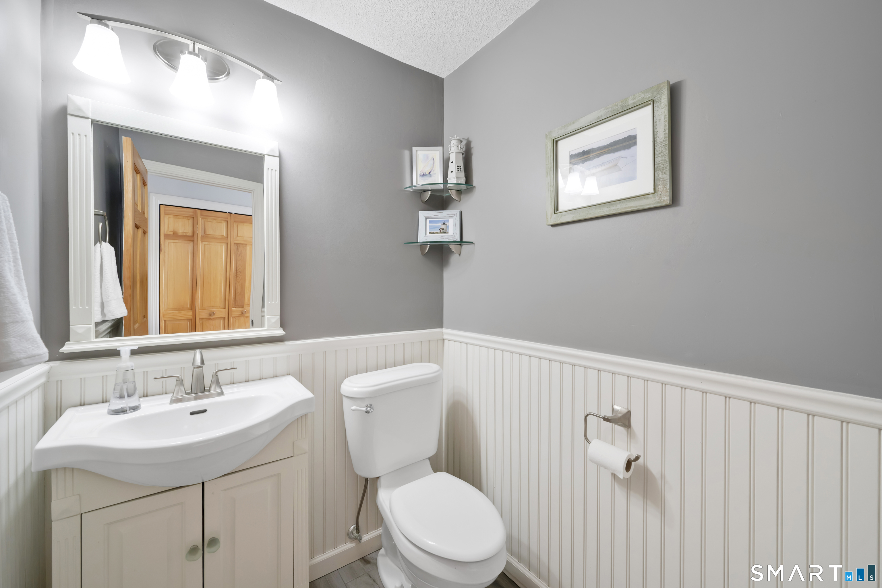 16 Higgins Way Tolland, CT 06084 - Photo 16 of 42 a bathroom with a toilet a sink and mirror