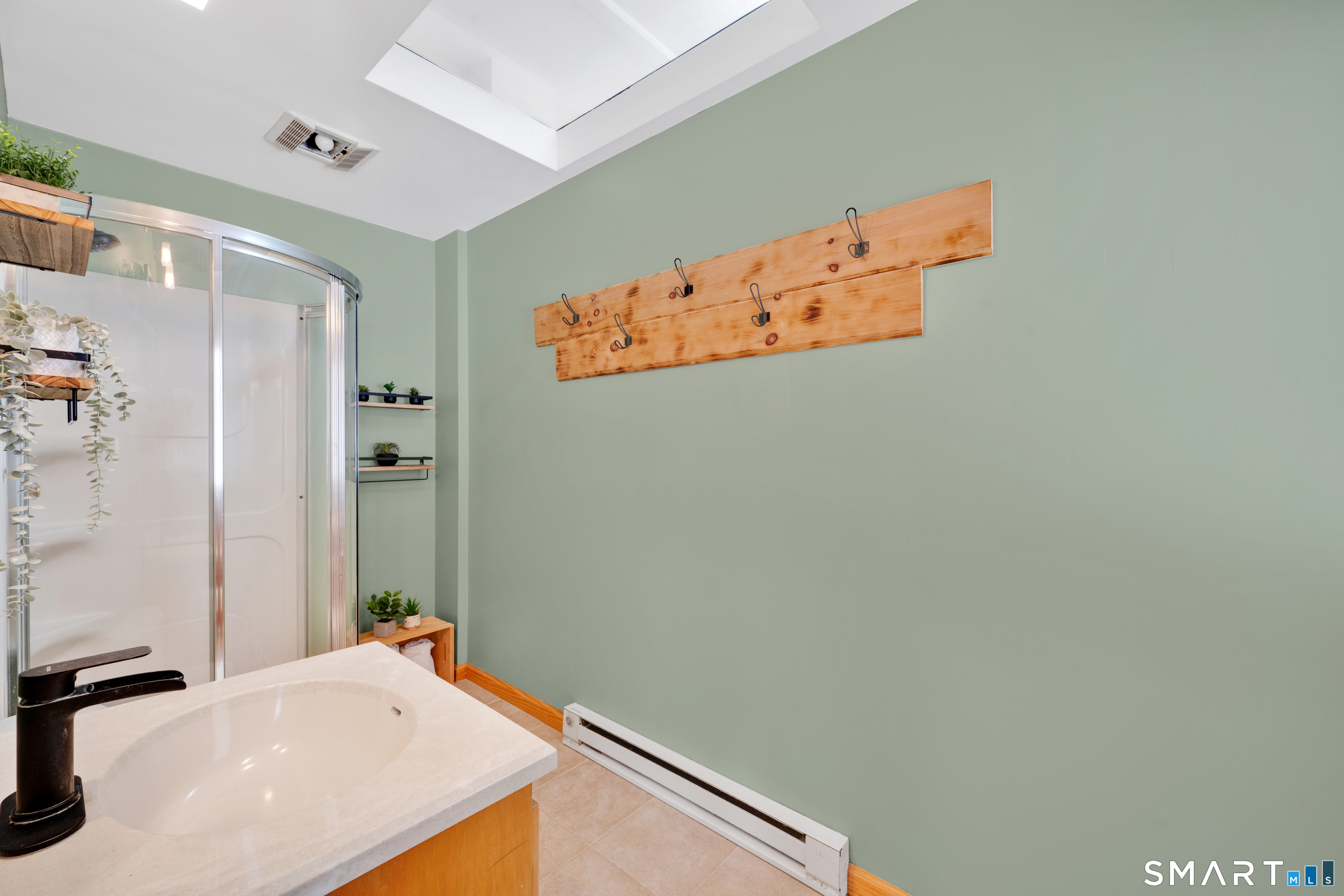 16 Higgins Way Tolland, CT 06084 - Photo 19 of 42 a bathroom with a sink and a mirror