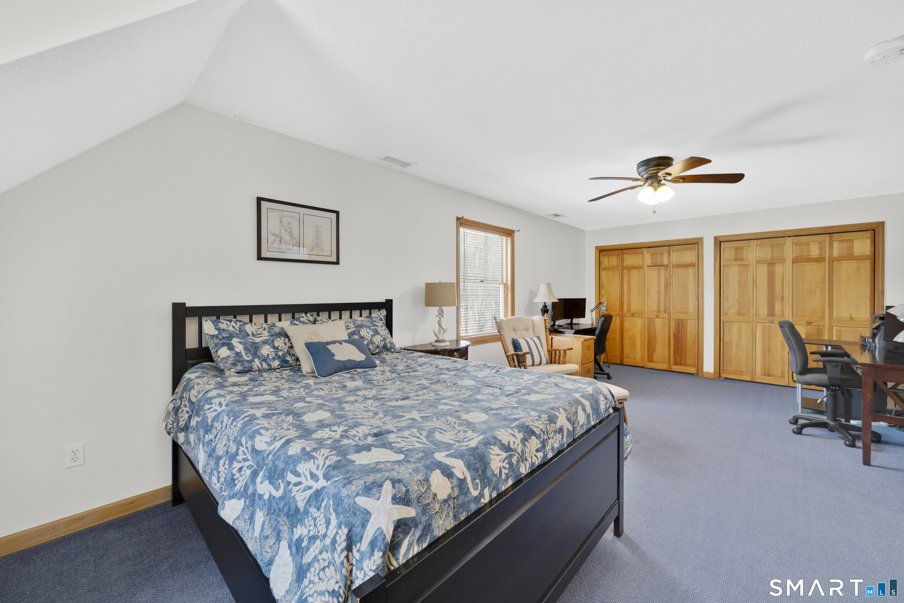 16 Higgins Way Tolland, CT 06084 - Photo 21 of 42 a bedroom with a large bed and a chandelier