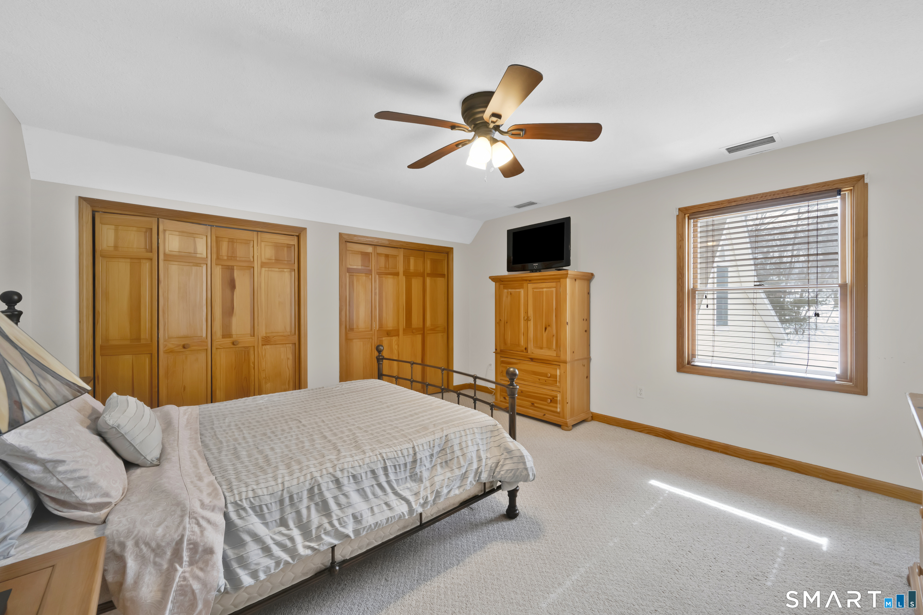 16 Higgins Way Tolland, CT 06084 - Photo 24 of 42 a bedroom with a bed and window