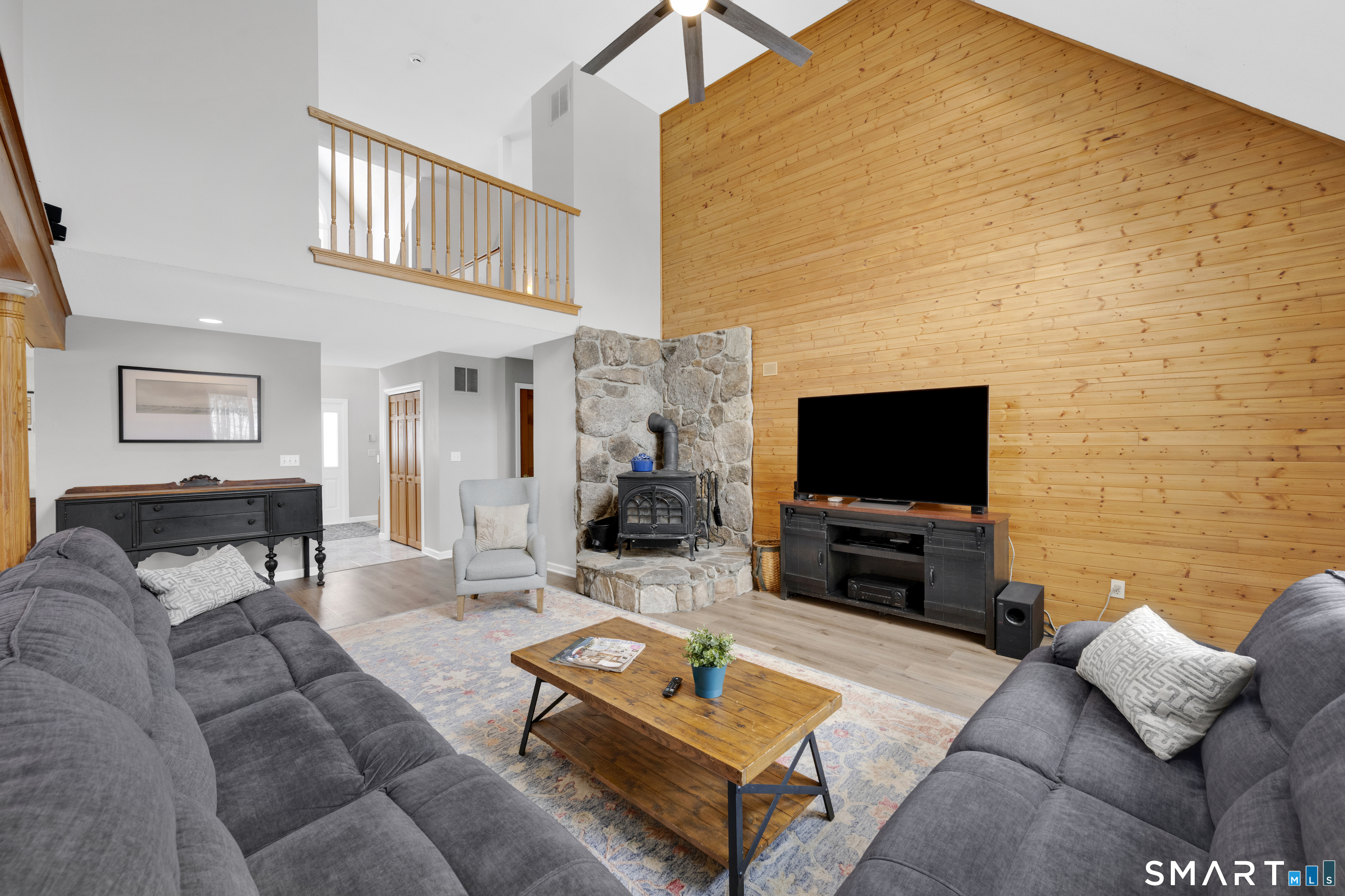 16 Higgins Way Tolland, CT 06084 - Photo 3 of 42 a living room with furniture and a flat screen tv