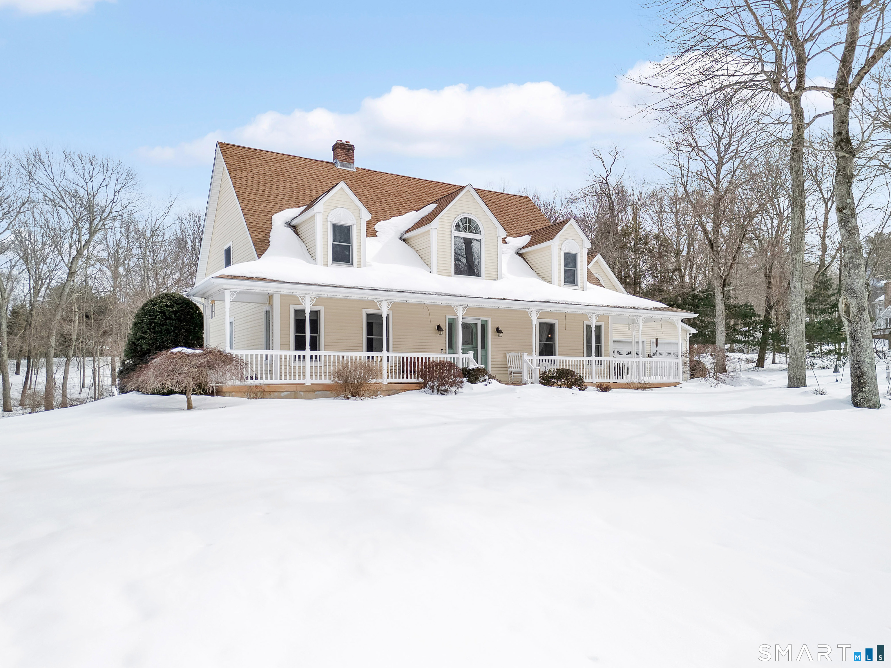 16 Higgins Way Tolland, CT 06084 - Photo 32 of 42 a front view of a house with a yard covered in snow