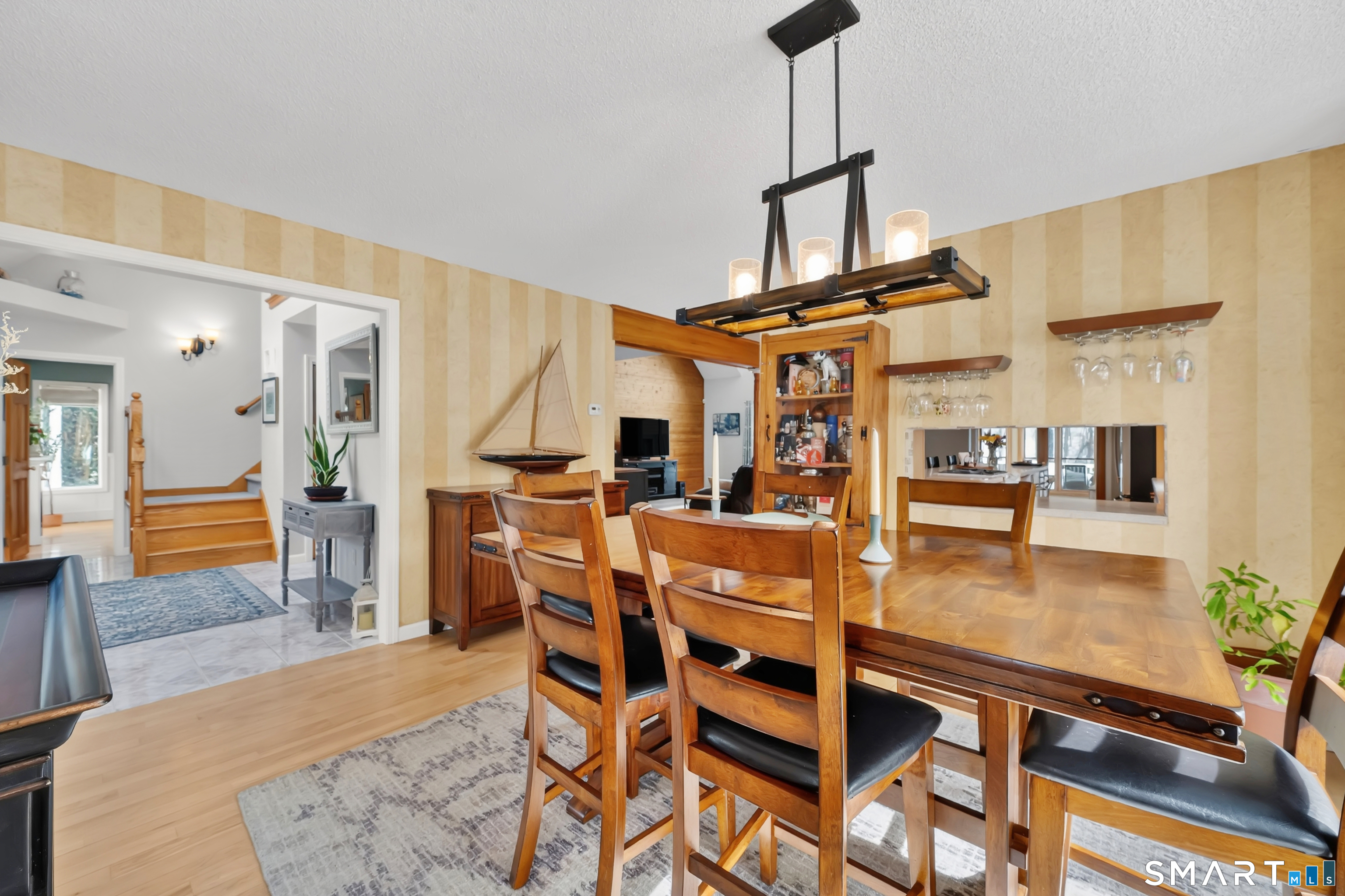16 Higgins Way Tolland, CT 06084 - Photo 35 of 42 a dining room with furniture and wooden floor