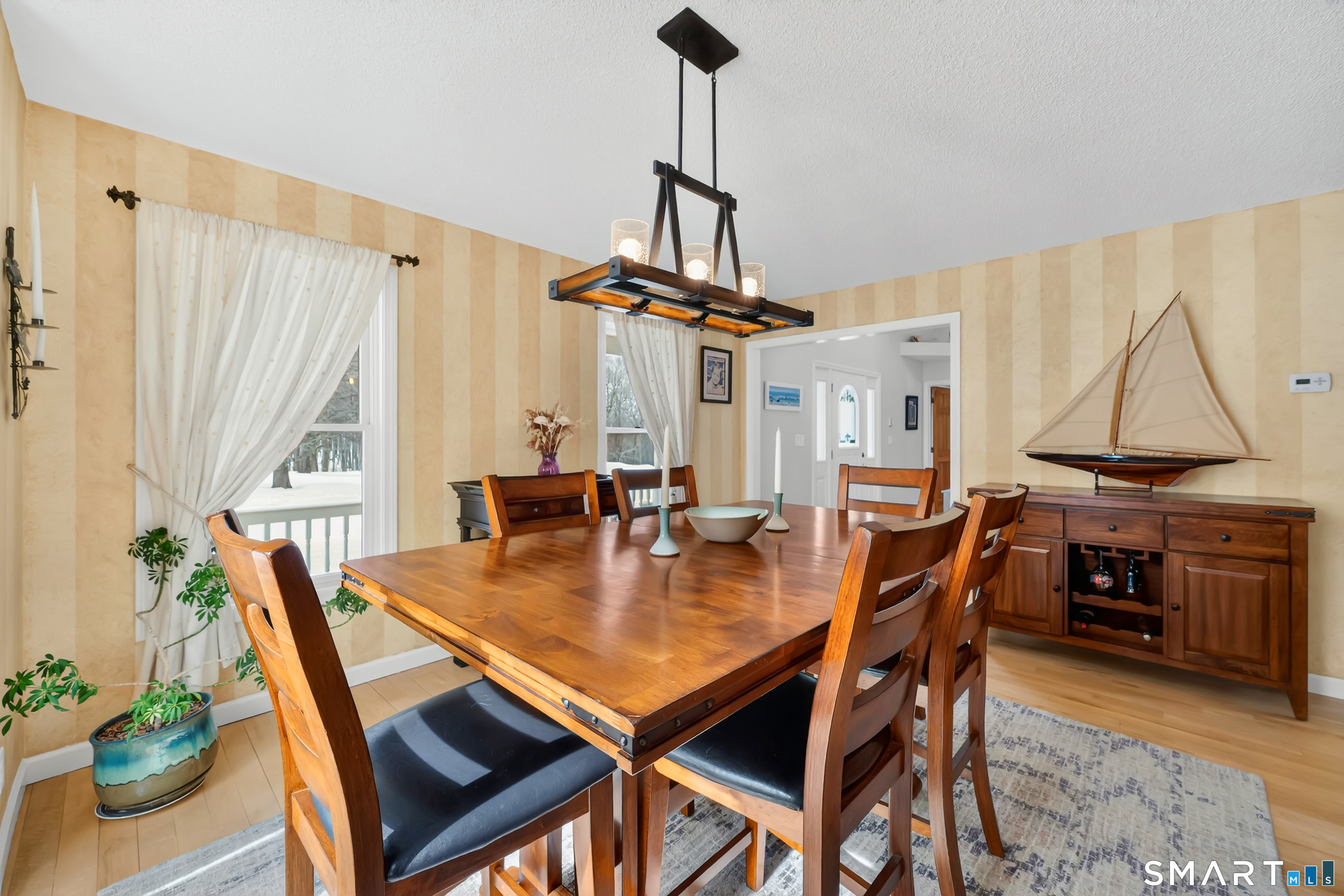16 Higgins Way Tolland, CT 06084 - Photo 36 of 42 a dining room with furniture window and wooden floor