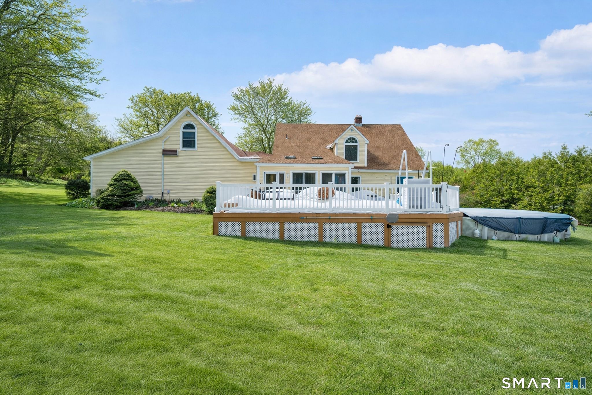 16 Higgins Way Tolland, CT 06084 - Photo 42 of 42 a view of a house with a yard and sitting area