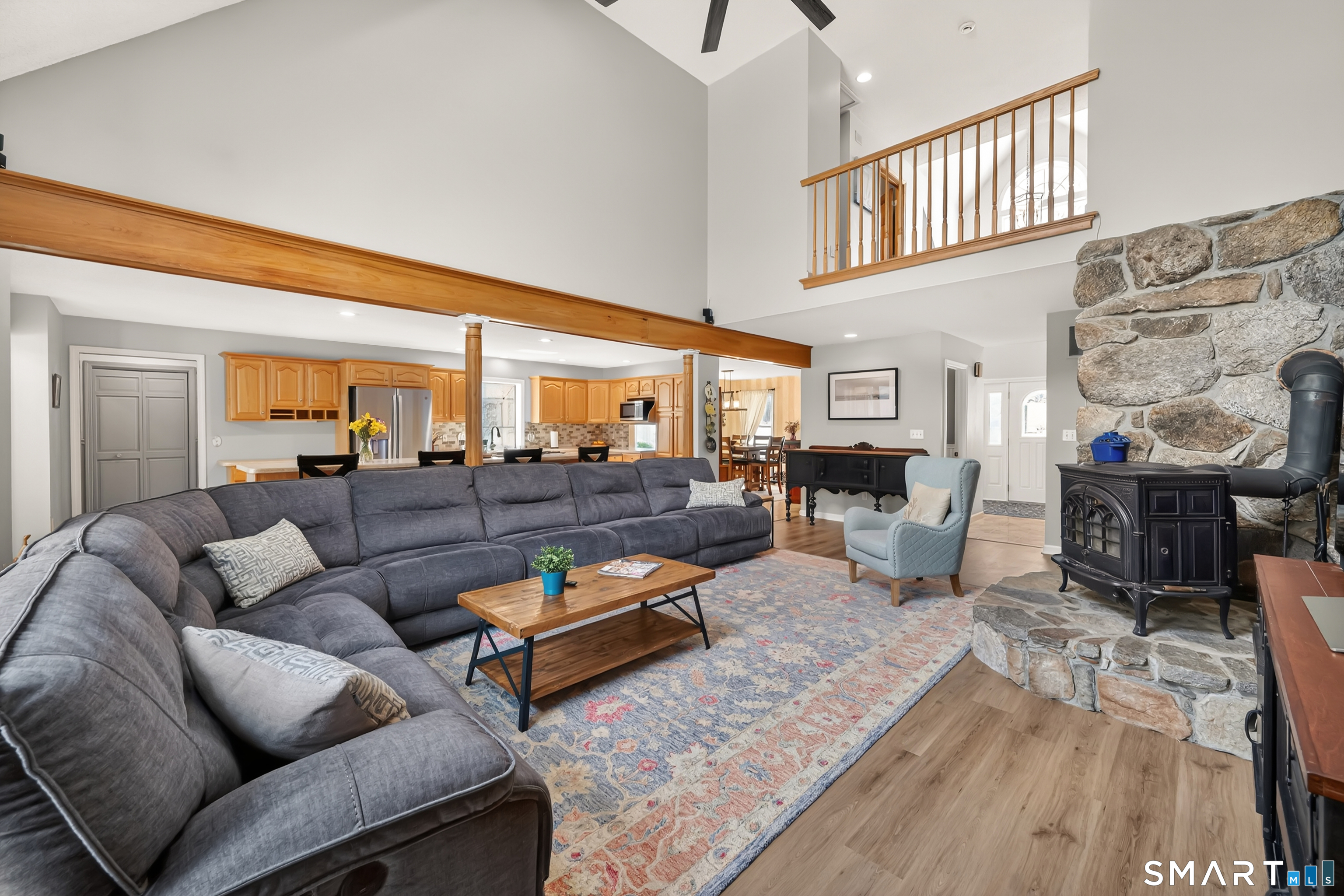 16 Higgins Way Tolland, CT 06084 - Photo 6 of 42 a living room with furniture wooden floor and a fireplace