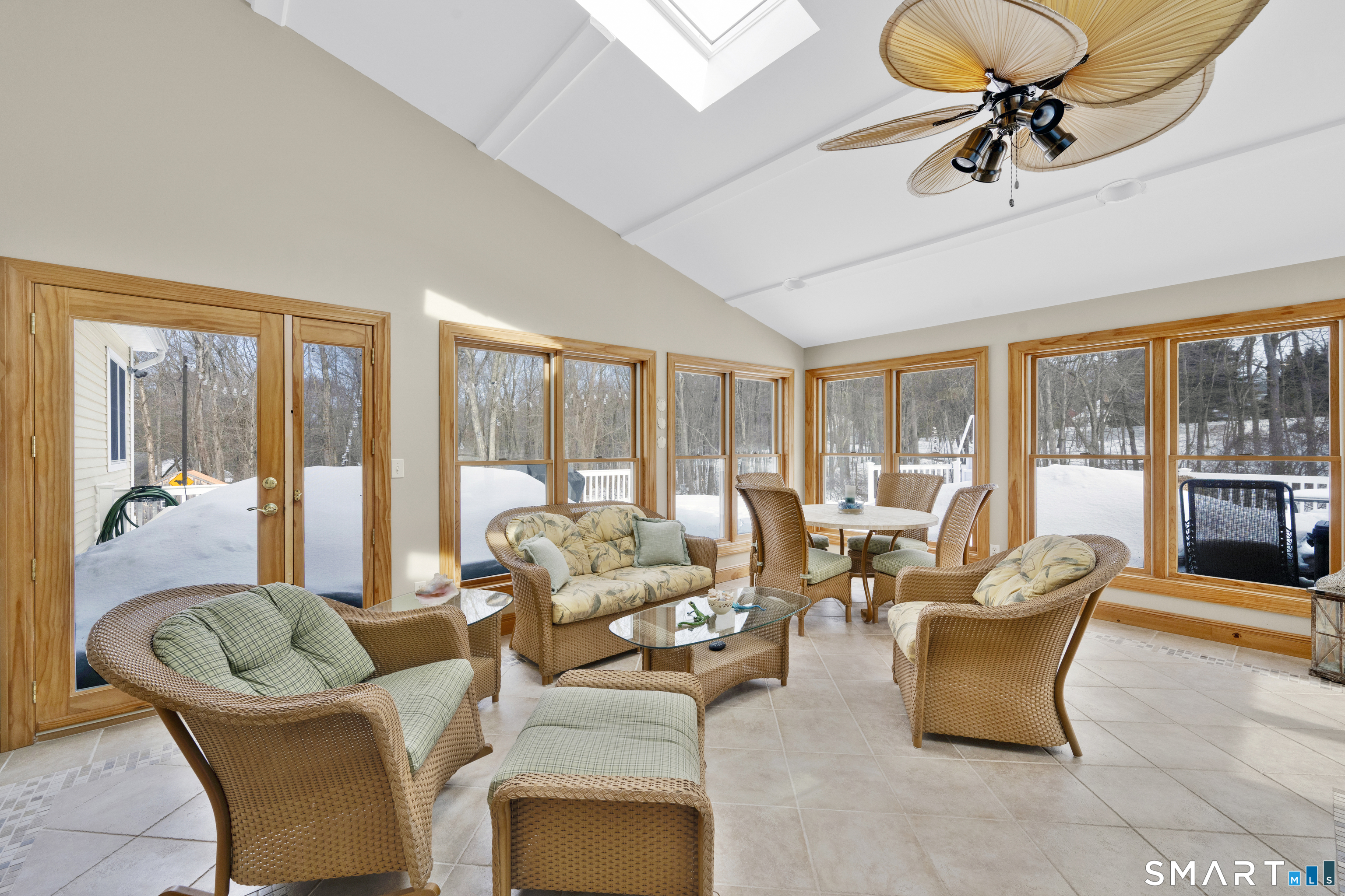 16 Higgins Way Tolland, CT 06084 - Photo 8 of 42 a living room with furniture ceiling fan and a floor to ceiling window