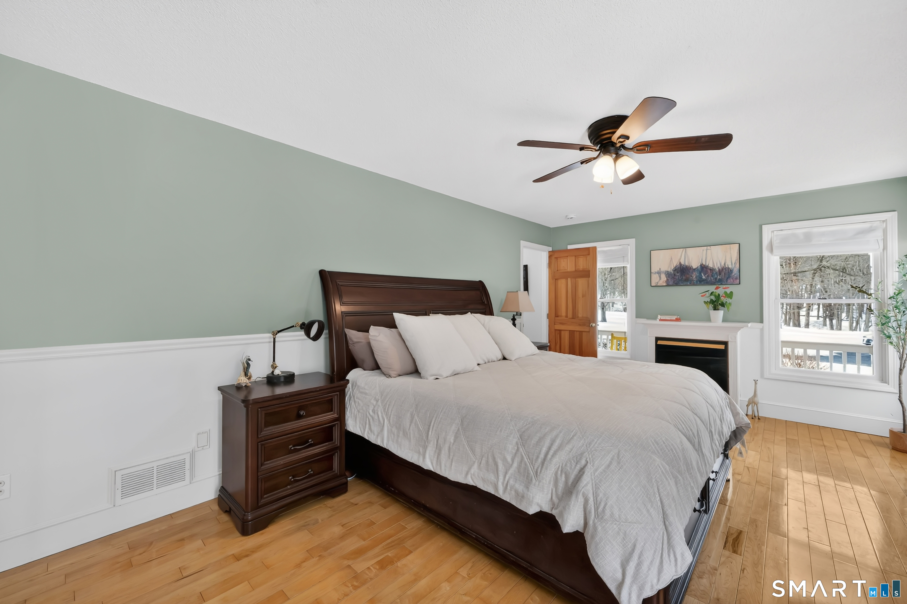 16 Higgins Way Tolland, CT 06084 - Photo 9 of 42 a bedroom with a large bed and a ceiling fan