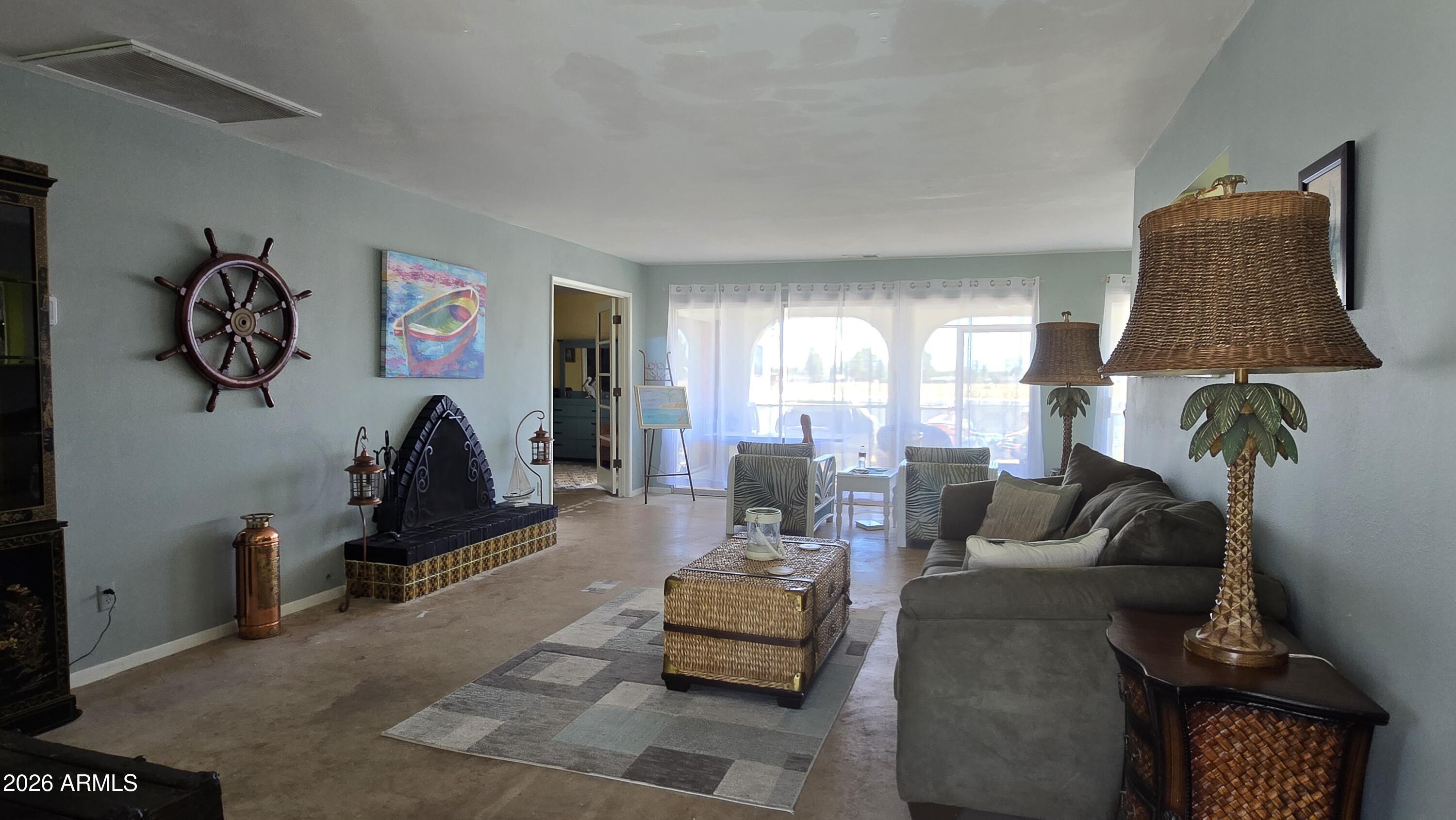 227 North Tracy Road Pearce, AZ 85625 - Photo 6 of 24 a living room with furniture and a flat screen tv