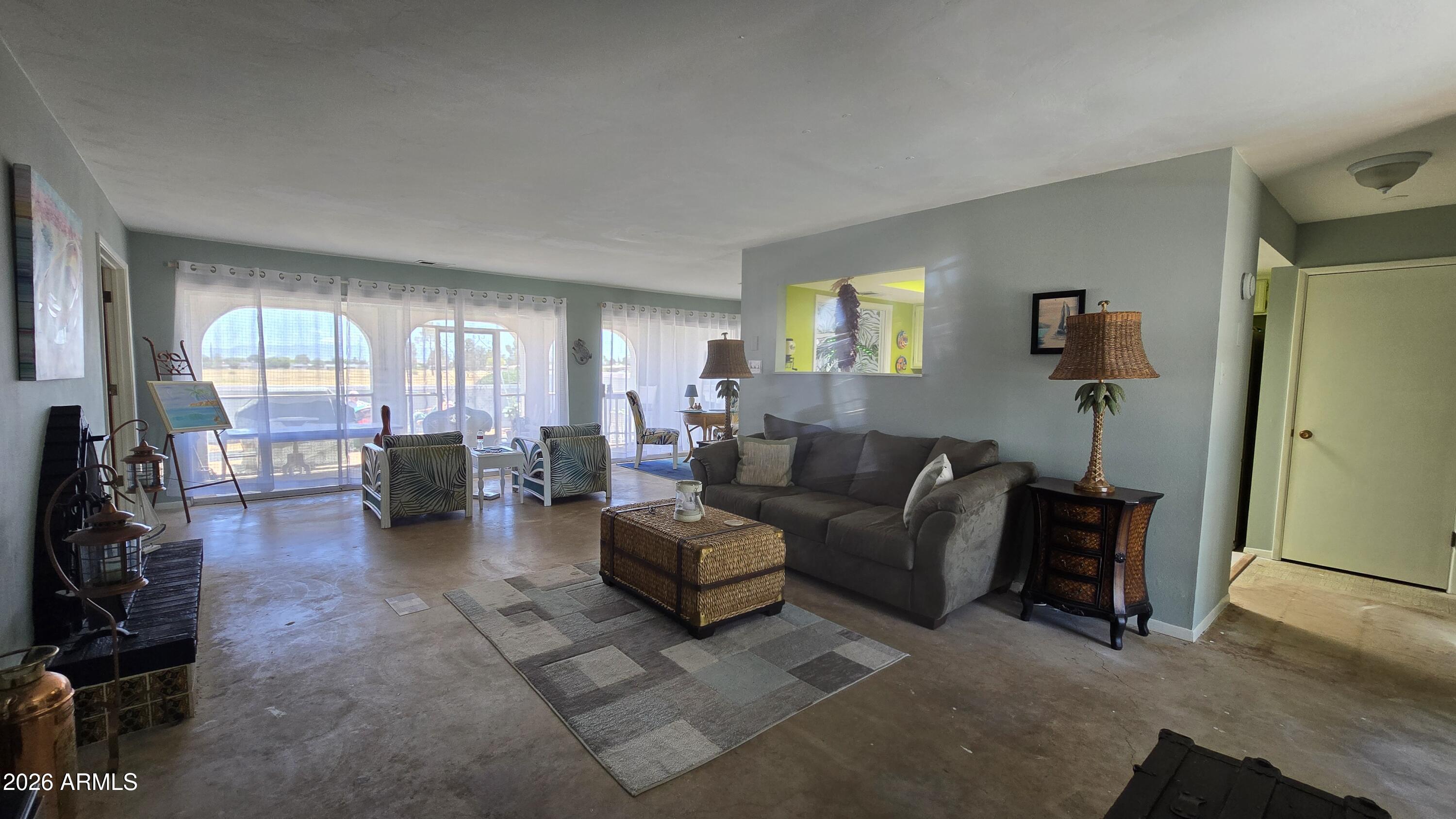 227 North Tracy Road Pearce, AZ 85625 - Photo 7 of 24 a living room with furniture and a flat screen tv