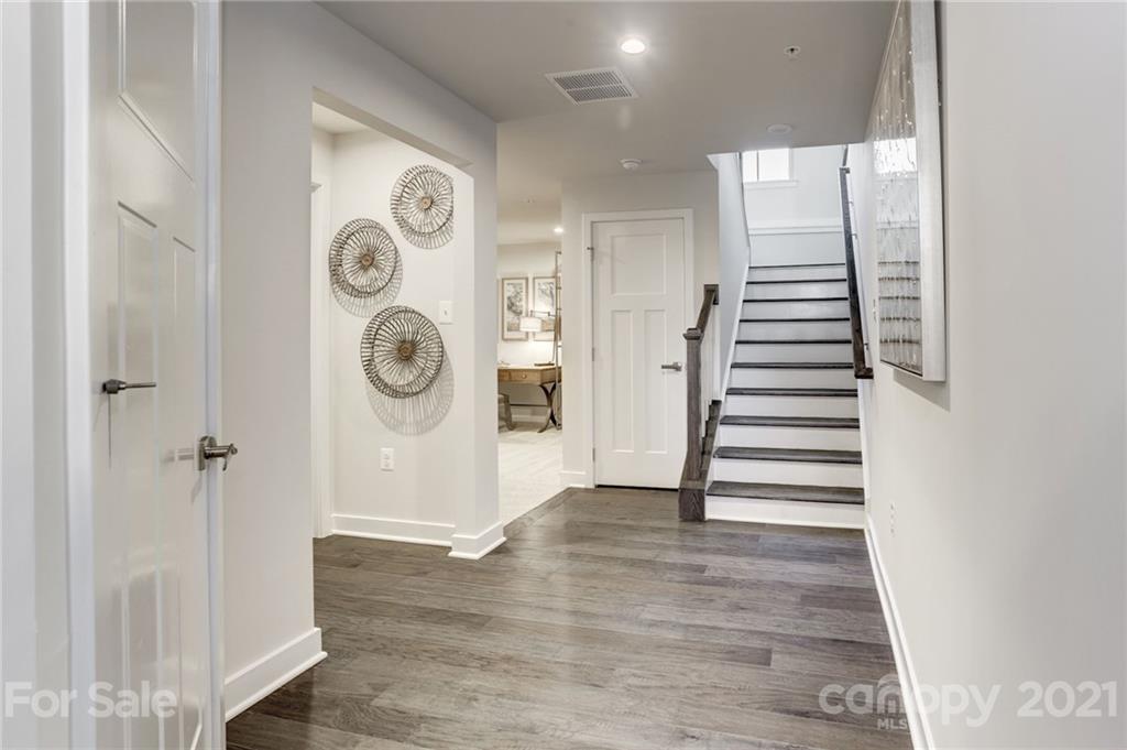 957 Portrush Lane, Unit 1010D Tega Cay, SC 29708 - Photo 1 of 13 a view of entryway with wooden floor