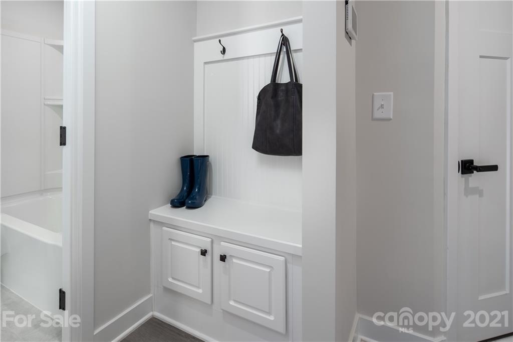 957 Portrush Lane, Unit 1010D Tega Cay, SC 29708 - Photo 2 of 13 a bathroom with a sink and a mirror