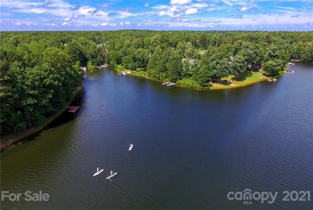 957 Portrush Lane, Unit 1010D Tega Cay, SC 29708 - Photo 13 of 13 a view of a back yard of a house with a yard