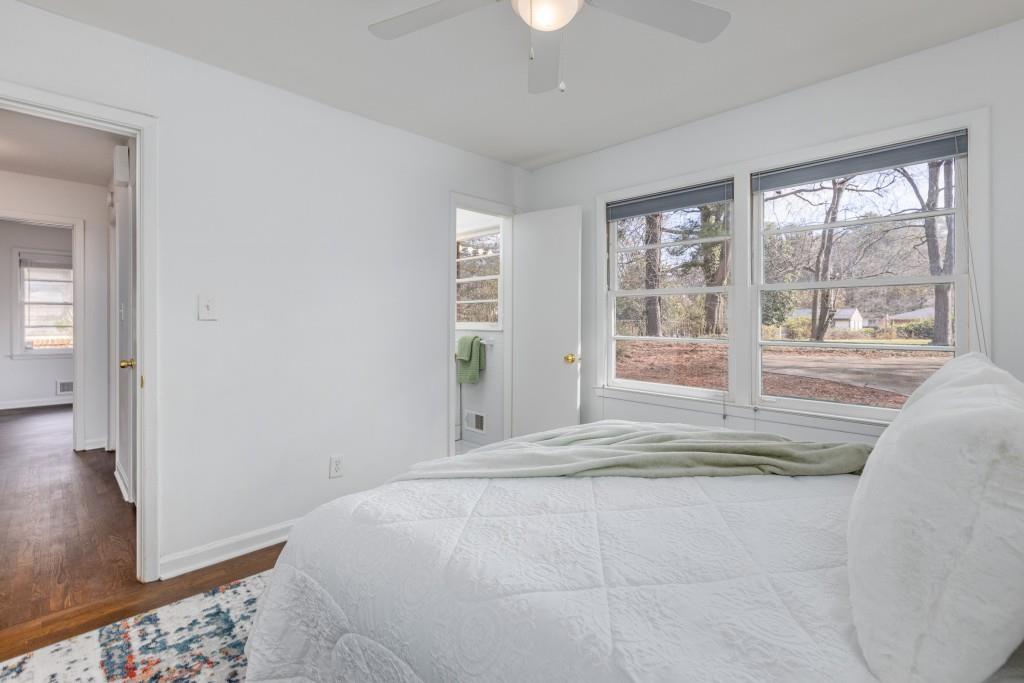 282 Willis Mill Road Southwest Atlanta, GA 30311 - Photo 12 of 25 a bedroom with a bed and a large window