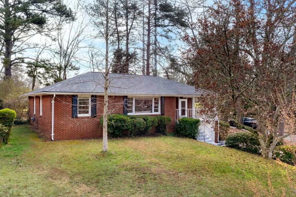 282 Willis Mill Road Southwest Atlanta, GA 30311 - Photo 22 of 25 front view of a house with a yard