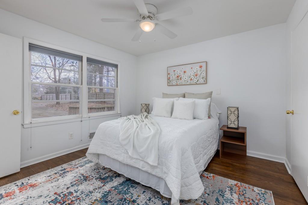 282 Willis Mill Road Southwest Atlanta, GA 30311 - Photo 4 of 25 a bedroom with a bed and a window
