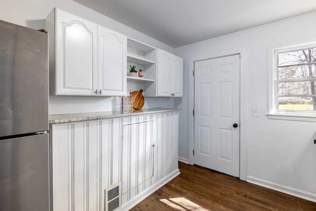 282 Willis Mill Road Southwest Atlanta, GA 30311 - Photo 10 of 25 a view of a utility room with closet and wooden floor