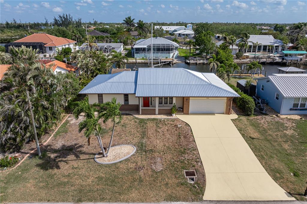 520 Boardman Drive Punta Gorda, FL 33950 - Photo 1 of 1 an aerial view of a house with yard and mountain view in back
