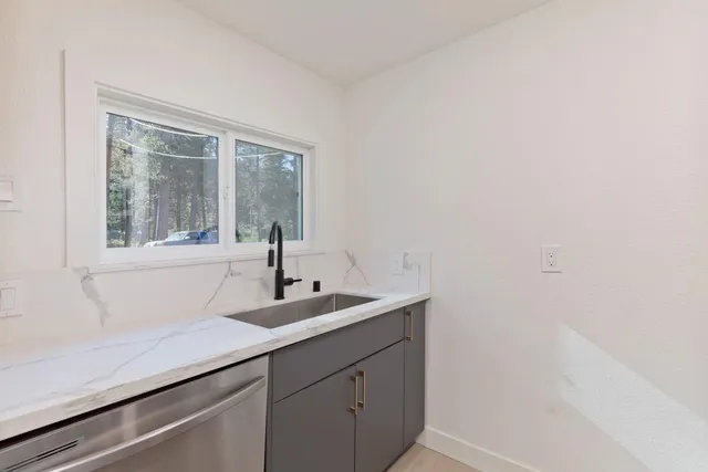 a bathroom with a sink and a window