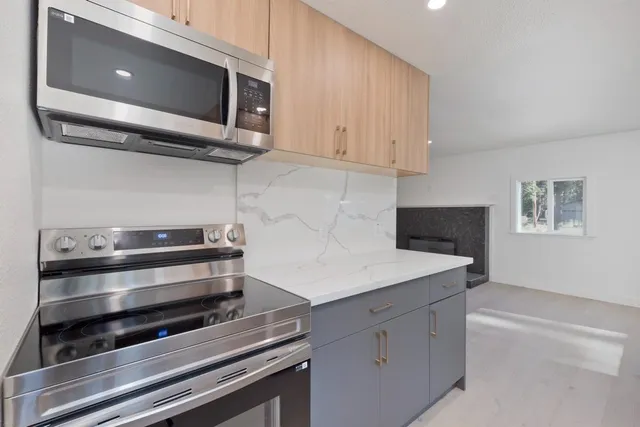 a kitchen with appliances and cabinets