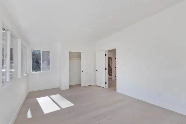 a view of a wooden bench sitting in backyard