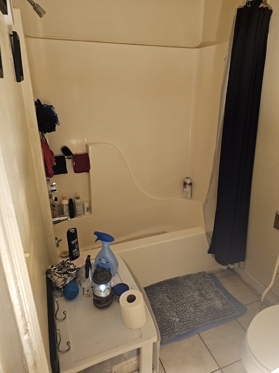 34 East Main Street, Unit 2 SOUTH Brockton, MA 02301 - Photo 11 of 14 a bathroom with a sink and a mirror