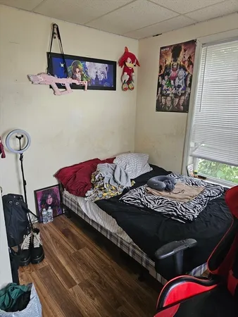 a view of a room with wooden floor