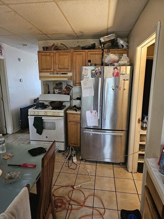 34 East Main Street, Unit 2 SOUTH Brockton, MA 02301 - Photo 8 of 14 a kitchen with a refrigerator a stove a washer and dryer
