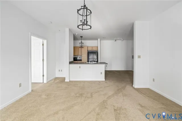 a view of a kitchen with a sink and cabinet area