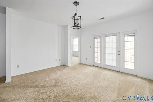 a view of empty room with windows