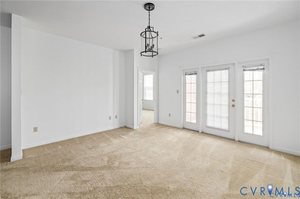 614 Bristol Village Drive, Unit 203 Midlothian, VA 23114 - Photo 16 of 32 a view of empty room with windows