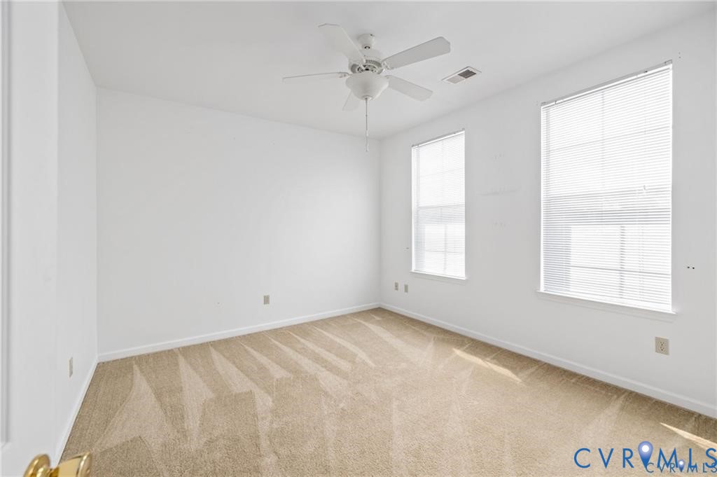 614 Bristol Village Drive, Unit 203 Midlothian, VA 23114 - Photo 19 of 32 wooden floor in an empty room with a window