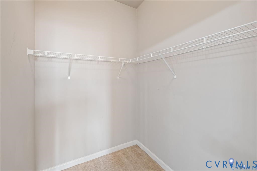 614 Bristol Village Drive, Unit 203 Midlothian, VA 23114 - Photo 27 of 32 a view of a room with racks on the wall