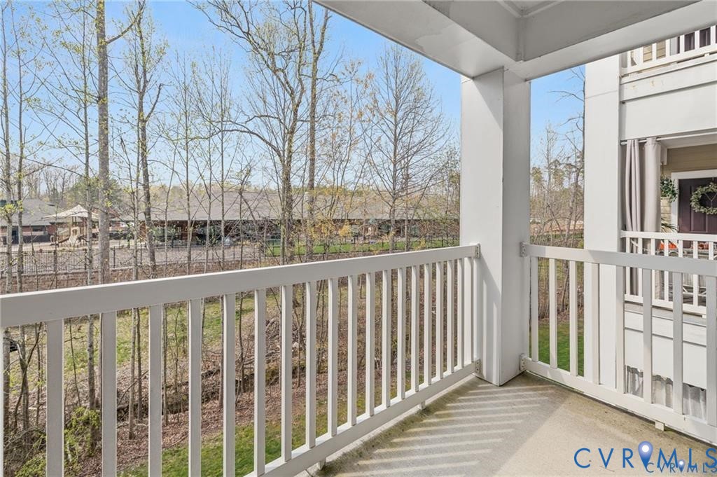 614 Bristol Village Drive, Unit 203 Midlothian, VA 23114 - Photo 30 of 32 a view of a large building from a balcony