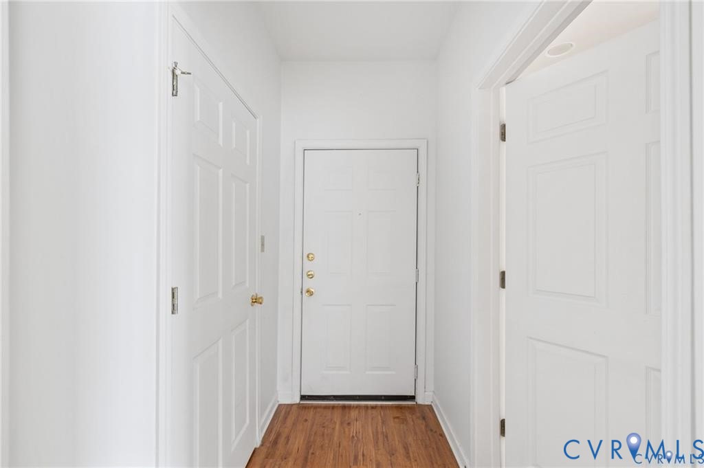 614 Bristol Village Drive, Unit 203 Midlothian, VA 23114 - Photo 5 of 32 a view of a hallway with wooden floor