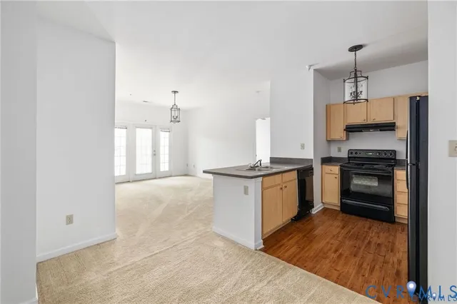 a kitchen with a stove and a refrigerator