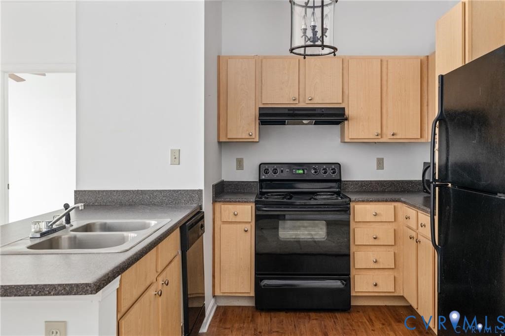 614 Bristol Village Drive, Unit 203 Midlothian, VA 23114 - Photo 8 of 32 a kitchen with stainless steel appliances granite countertop a sink stove and refrigerator
