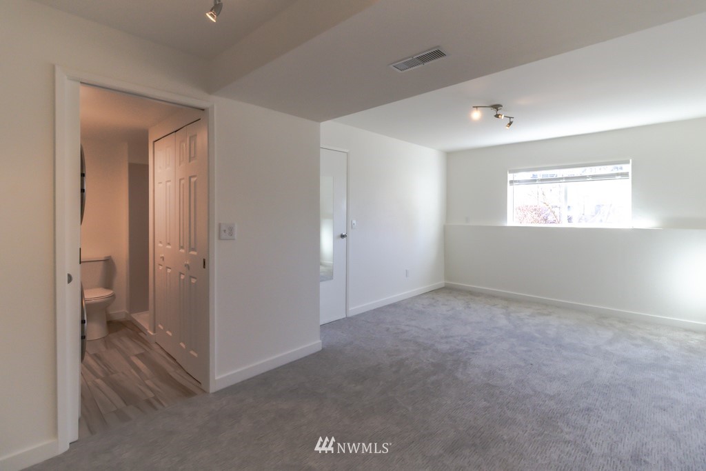 2829 Northeast 4th Court Renton, WA 98056 - Photo 17 of 26 a view of an empty room and a gallery