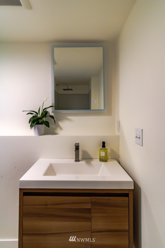 2829 Northeast 4th Court Renton, WA 98056 - Photo 19 of 26 a bathroom with a sink and a mirror